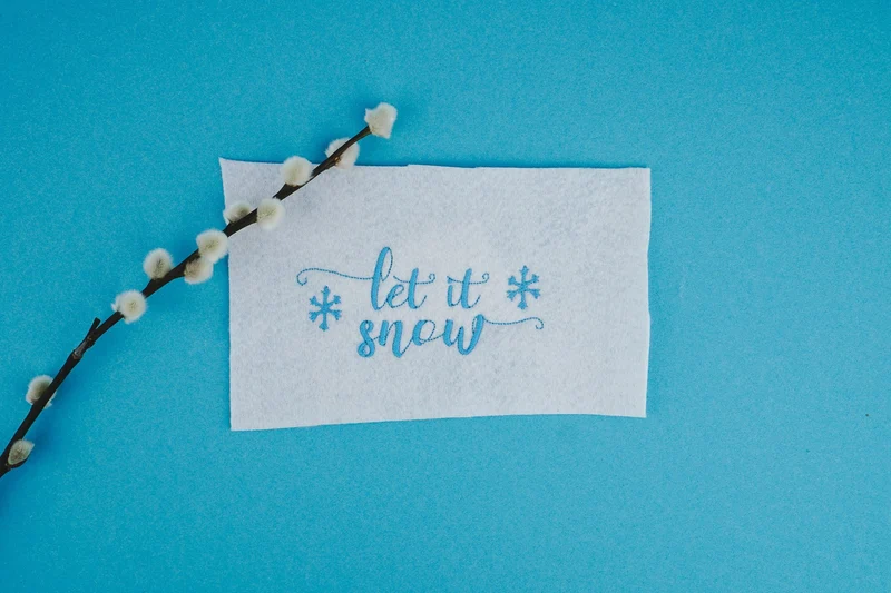 Stickdatei Schriftzug »let it snow« – 93,9 × 42,4 mm