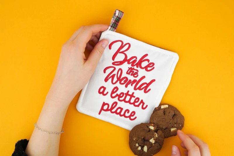 Stickdatei Schriftzug »bake the world a better place«