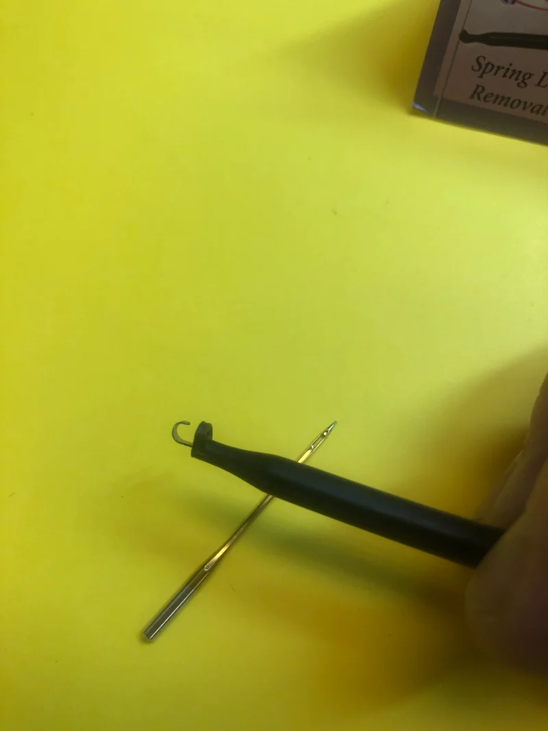Needle Grabber with handle. Spring loaded hook to hold sewing machine needle to insert in machine B90