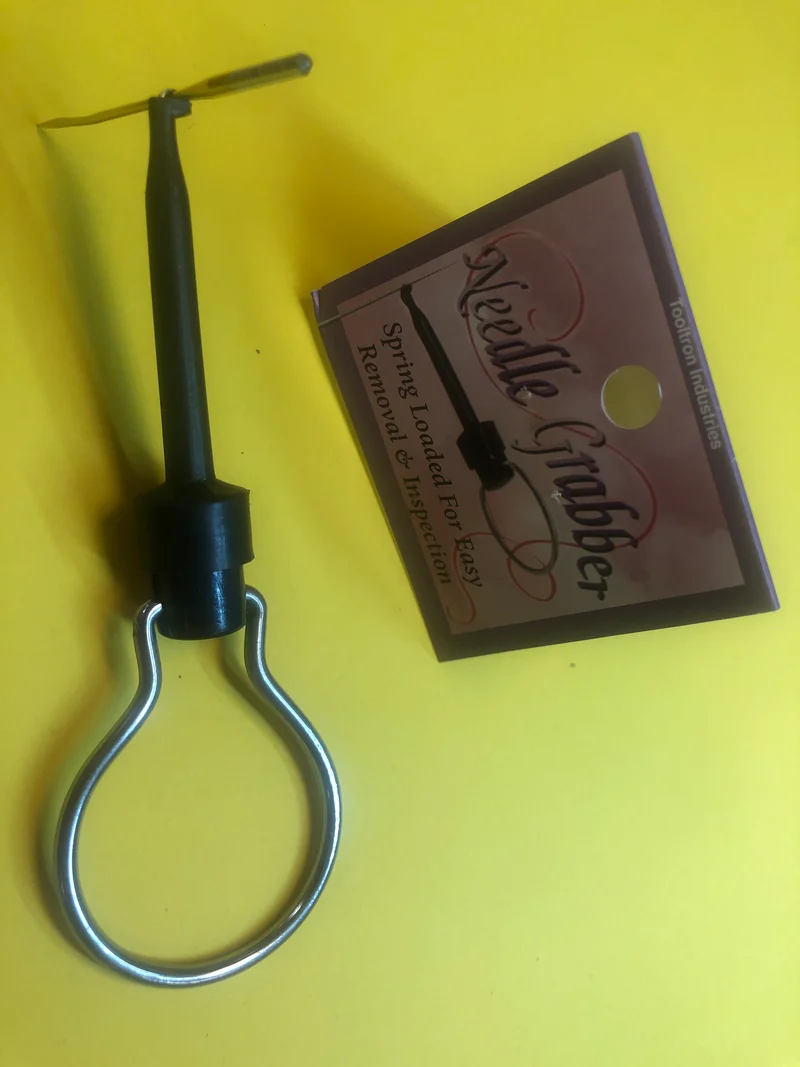 Needle Grabber with handle. Spring loaded hook to hold sewing machine needle to insert in machine B90