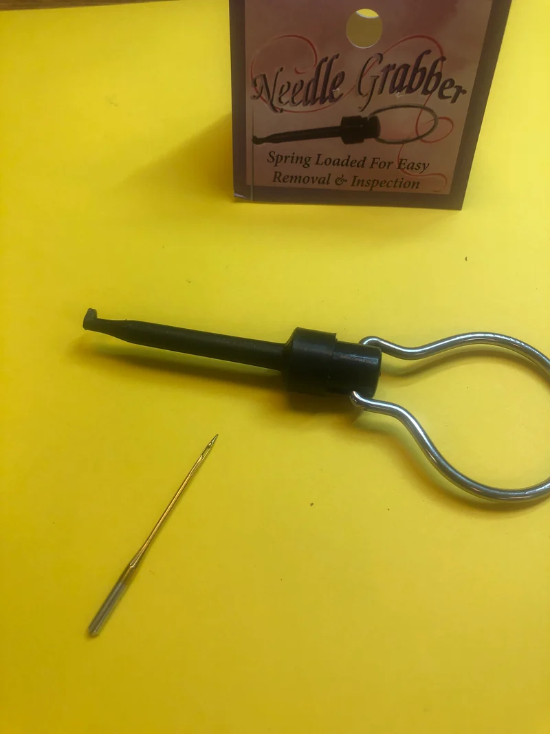 Needle Grabber with handle. Spring loaded hook to hold sewing machine needle to insert in machine B90