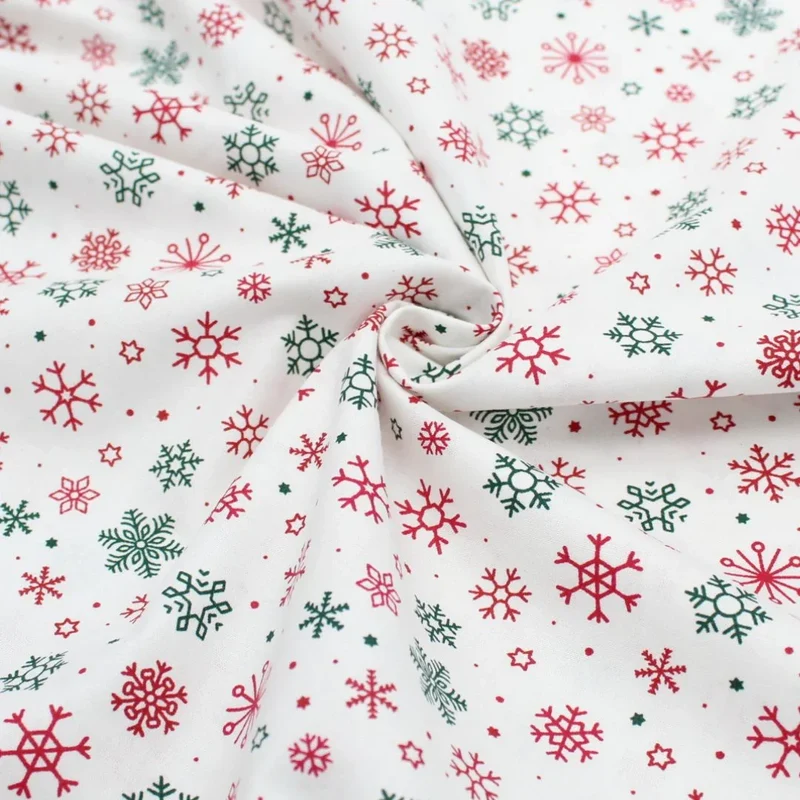 Popeline Stoff Weihnachtsstoff Schneeflocken und Sterne